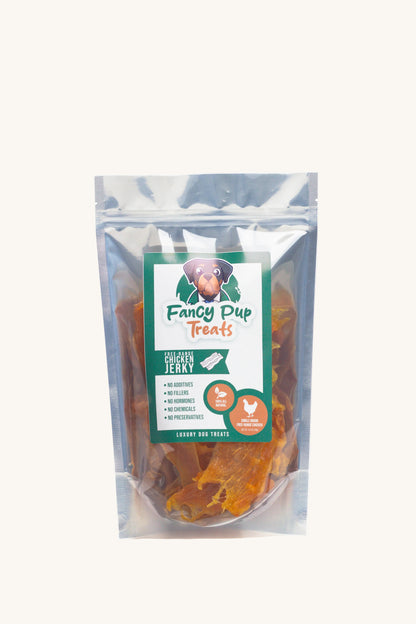 Package of Fancy Pup Treats Chicken Jerky on a white background